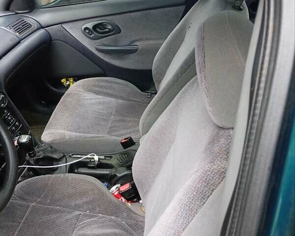 Зеленый Форд Мондео, объемом двигателя 1.8 л и пробегом 280 тыс. км за 1200 $, фото 5 на Automoto.ua