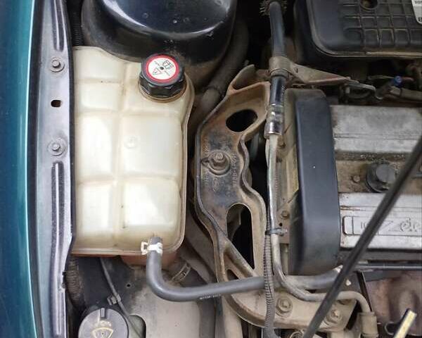 Зеленый Форд Мондео, объемом двигателя 1.8 л и пробегом 280 тыс. км за 1200 $, фото 4 на Automoto.ua