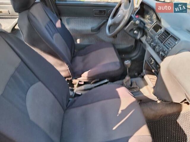 Білий Форд Оріон, об'ємом двигуна 1.39 л та пробігом 49 тис. км за 1300 $, фото 3 на Automoto.ua