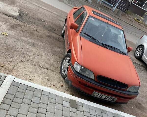 Красный Форд Орион, объемом двигателя 1.8 л и пробегом 56 тыс. км за 750 $, фото 2 на Automoto.ua