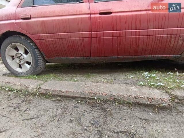 Красный Форд Орион, объемом двигателя 2 л и пробегом 186 тыс. км за 599 $, фото 2 на Automoto.ua