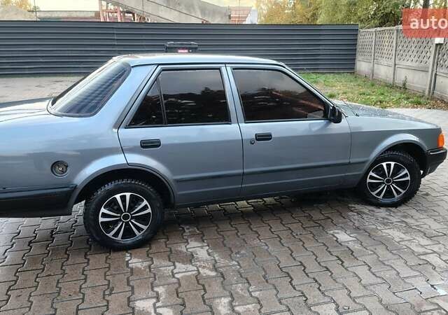 Форд Орион 1988 в Сумах на Automoto.ua Серый Форд Орион, объемом двигателя 1.4 л и пробегом 96 тыс. км за 2600 $, фото 9 на Automoto.ua