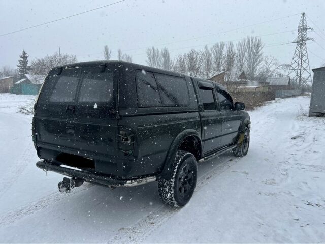 Черный Форд Рейнджер, объемом двигателя 2.5 л и пробегом 230 тыс. км за 3950 $, фото 4 на Automoto.ua