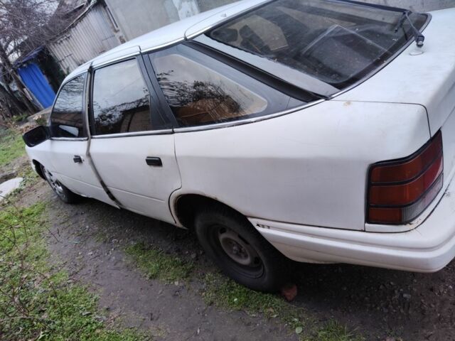 Белый Форд Скорпио, объемом двигателя 1.8 л и пробегом 210 тыс. км за 582 $, фото 1 на Automoto.ua