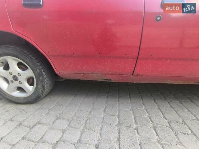 Красный Форд Сиерра, объемом двигателя 1.6 л и пробегом 100 тыс. км за 700 $, фото 1 на Automoto.ua
