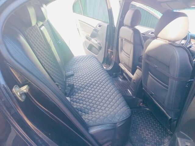 Черный Джили Эмгранд, объемом двигателя 1.8 л и пробегом 111 тыс. км за 5000 $, фото 6 на Automoto.ua