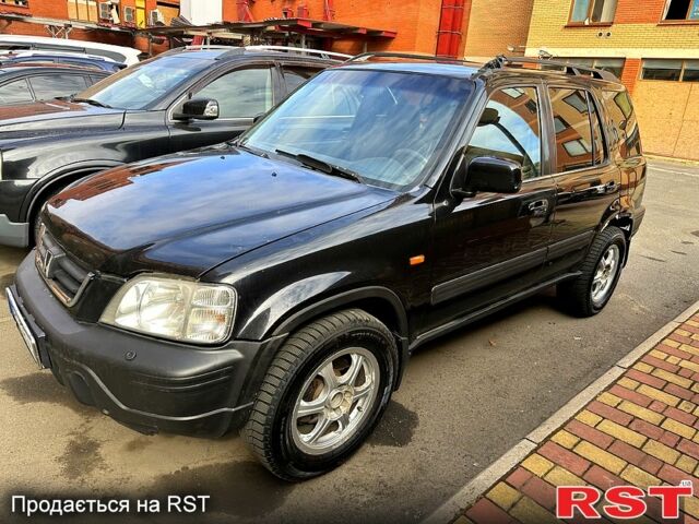 Черный Хонда СРВ, объемом двигателя 2 л и пробегом 222 тыс. км за 4000 $, фото 1 на Automoto.ua