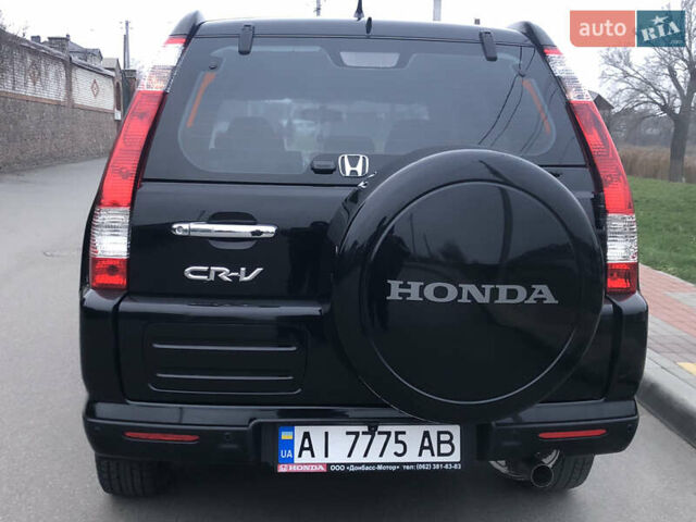 Чорний Хонда СРВ, об'ємом двигуна 2 л та пробігом 97 тис. км за 11200 $, фото 30 на Automoto.ua