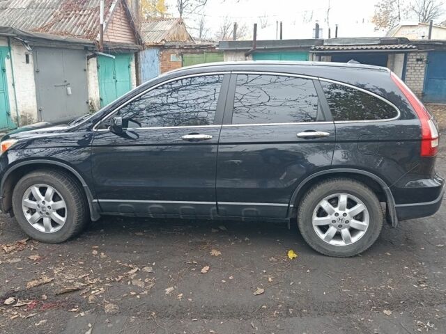 Черный Хонда СРВ, объемом двигателя 2.4 л и пробегом 197 тыс. км за 12000 $, фото 1 на Automoto.ua