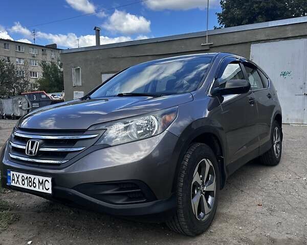 Коричневый Хонда СРВ, объемом двигателя 2.35 л и пробегом 210 тыс. км за 12400 $, фото 1 на Automoto.ua