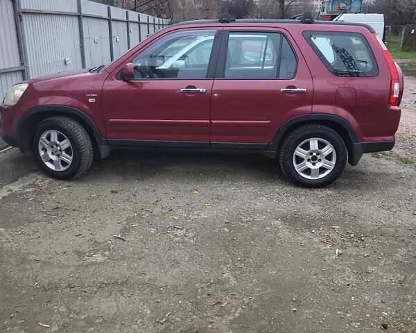 Красный Хонда СРВ, объемом двигателя 2 л и пробегом 257 тыс. км за 6876 $, фото 1 на Automoto.ua