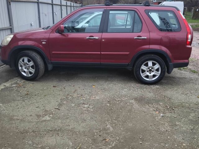 Красный Хонда СРВ, объемом двигателя 2 л и пробегом 257 тыс. км за 6876 $, фото 2 на Automoto.ua