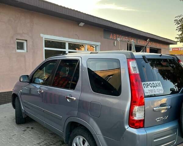 Серый Хонда СРВ, объемом двигателя 2 л и пробегом 251 тыс. км за 7500 $, фото 1 на Automoto.ua