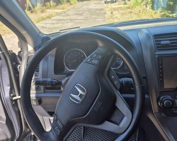 Серый Хонда СРВ, объемом двигателя 2.35 л и пробегом 178 тыс. км за 13600 $, фото 12 на Automoto.ua