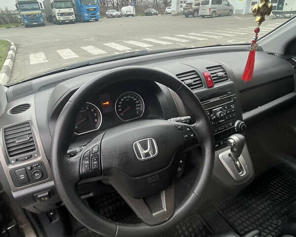 Серый Хонда СРВ, объемом двигателя 2.35 л и пробегом 179 тыс. км за 13600 $, фото 6 на Automoto.ua