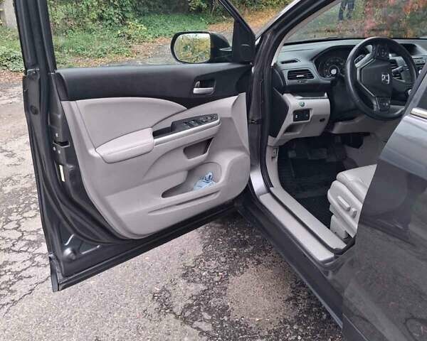 Хонда СРВ 2014 в Полтаве на Automoto.ua Серый Хонда СРВ, объемом двигателя 2.36 л и пробегом 149 тыс. км за 15500 $, фото 11 на Automoto.ua