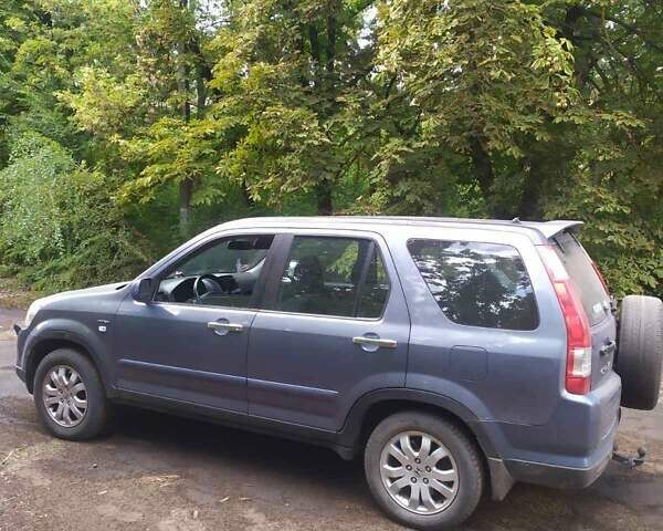 Синий Хонда СРВ, объемом двигателя 2 л и пробегом 244 тыс. км за 5000 $, фото 1 на Automoto.ua