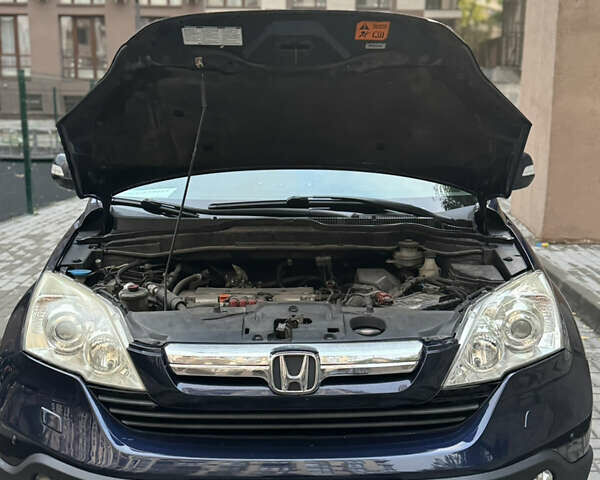 Синий Хонда СРВ, объемом двигателя 2.36 л и пробегом 245 тыс. км за 10000 $, фото 1 на Automoto.ua