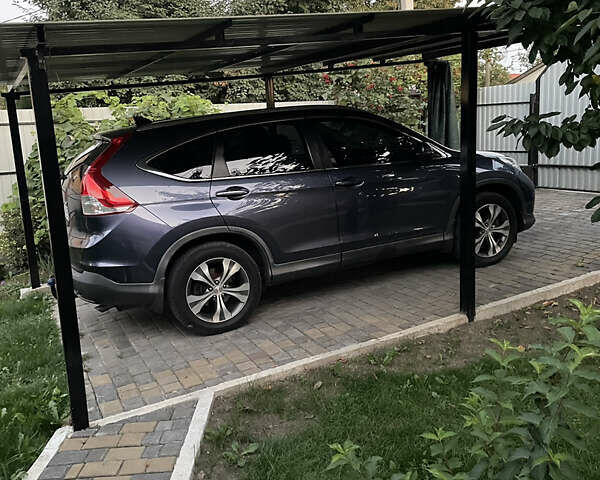 Синий Хонда СРВ, объемом двигателя 2 л и пробегом 260 тыс. км за 17000 $, фото 4 на Automoto.ua