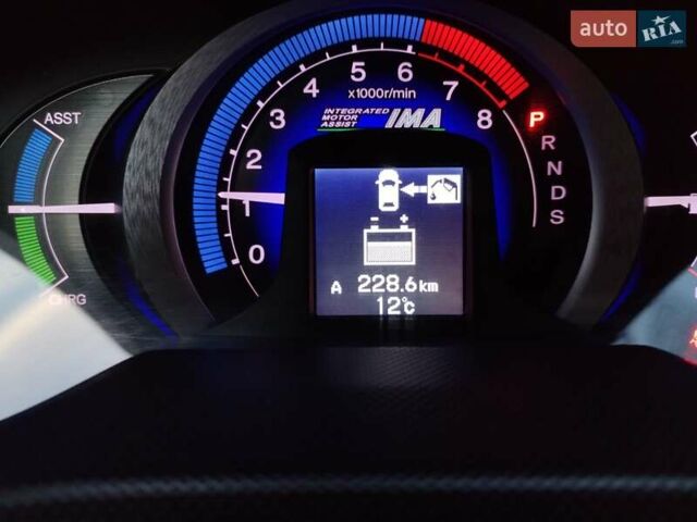 Черный Хонда Инсайт, объемом двигателя 1.34 л и пробегом 177 тыс. км за 9800 $, фото 29 на Automoto.ua