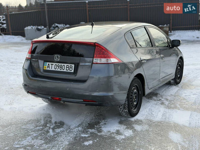 Серый Хонда Инсайт, объемом двигателя 1.34 л и пробегом 305 тыс. км за 5600 $, фото 1 на Automoto.ua