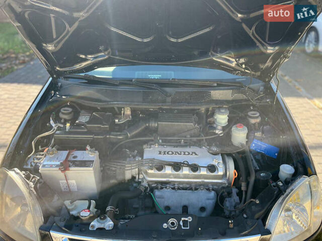 Черный Хонда Лого, объемом двигателя 1.4 л и пробегом 200 тыс. км за 2600 $, фото 4 на Automoto.ua
