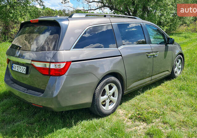 Серый Хонда Одиссей, объемом двигателя 3.47 л и пробегом 301 тыс. км за 11850 $, фото 3 на Automoto.ua