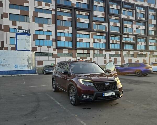 Красный Хонда Пасспорт, объемом двигателя 3.47 л и пробегом 87 тыс. км за 21999 $, фото 2 на Automoto.ua