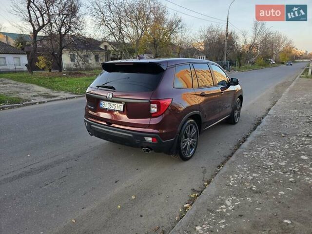 Красный Хонда Пасспорт, объемом двигателя 3.47 л и пробегом 87 тыс. км за 21999 $, фото 56 на Automoto.ua