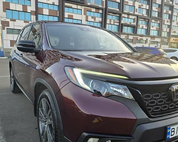 Красный Хонда Пасспорт, объемом двигателя 3.47 л и пробегом 87 тыс. км за 21999 $, фото 1 на Automoto.ua