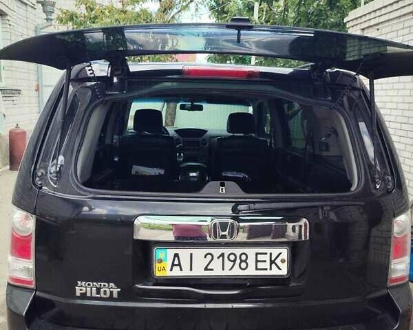 Чорний Хонда Пілот, об'ємом двигуна 3.5 л та пробігом 244 тис. км за 11500 $, фото 3 на Automoto.ua