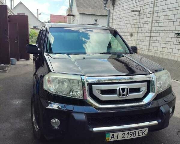 Чорний Хонда Пілот, об'ємом двигуна 3.5 л та пробігом 244 тис. км за 11500 $, фото 1 на Automoto.ua