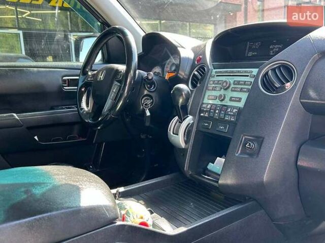 Чорний Хонда Пілот, об'ємом двигуна 3.47 л та пробігом 331 тис. км за 13700 $, фото 12 на Automoto.ua