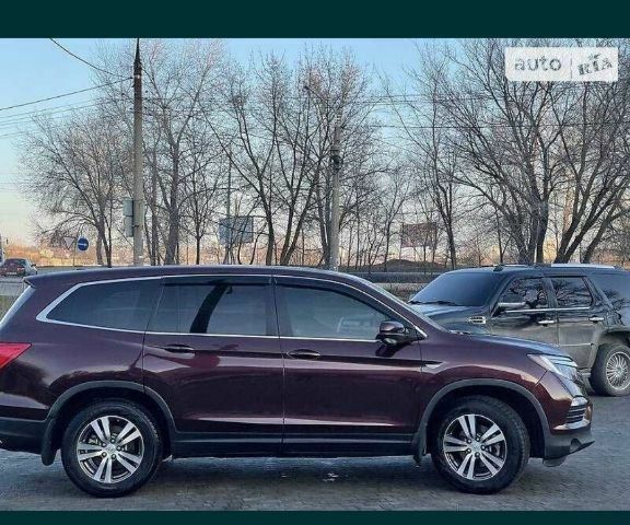 Красный Хонда Пилот, объемом двигателя 0 л и пробегом 180 тыс. км за 23400 $, фото 1 на Automoto.ua