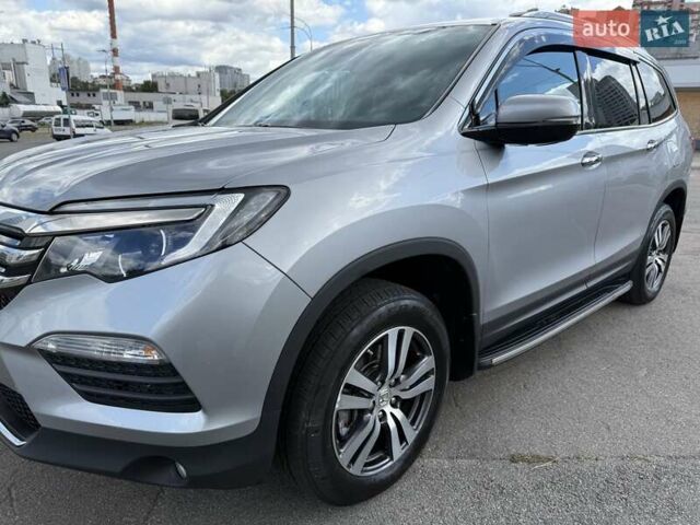 Серый Хонда Пилот, объемом двигателя 3 л и пробегом 125 тыс. км за 23500 $, фото 3 на Automoto.ua