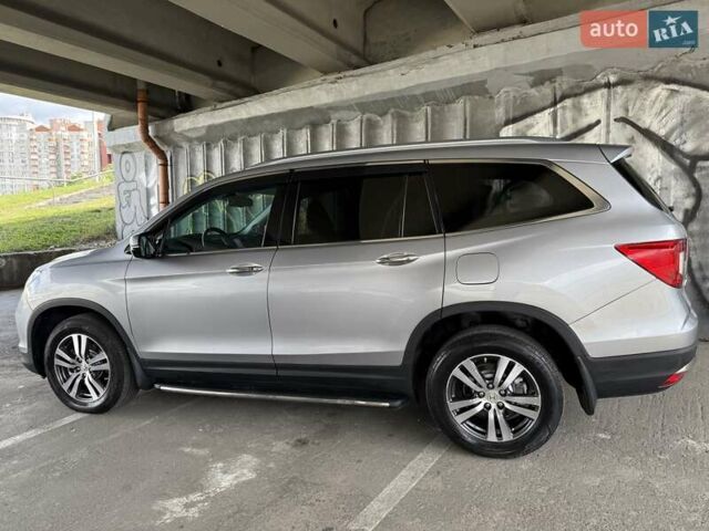 Серый Хонда Пилот, объемом двигателя 3 л и пробегом 125 тыс. км за 23000 $, фото 4 на Automoto.ua