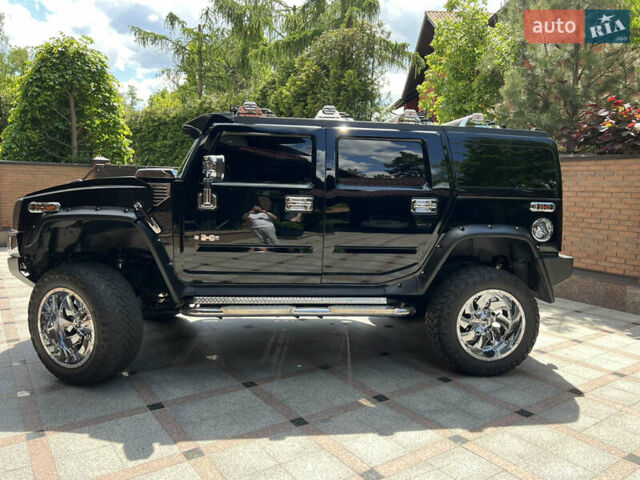 Чорний Хаммер Н2, об'ємом двигуна 6.2 л та пробігом 156 тис. км за 51000 $, фото 4 на Automoto.ua
