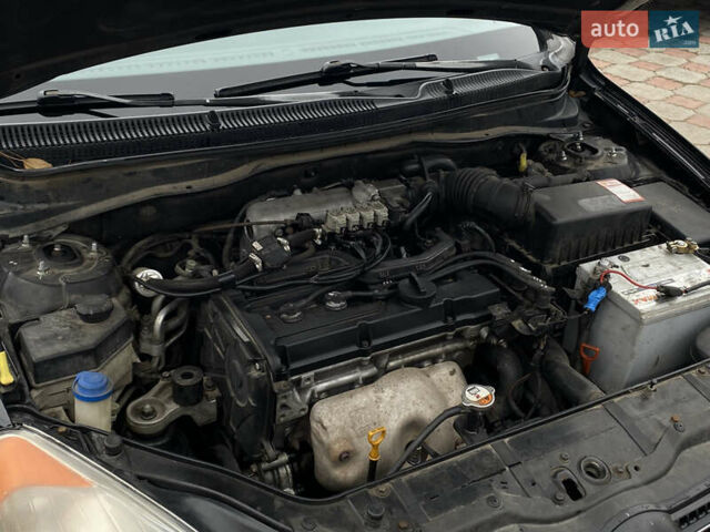 Черный Хендай Акцент, объемом двигателя 1.4 л и пробегом 215 тыс. км за 4799 $, фото 13 на Automoto.ua