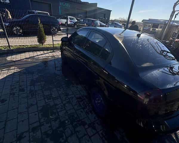 Черный Хендай Акцент, объемом двигателя 1.4 л и пробегом 210 тыс. км за 4050 $, фото 2 на Automoto.ua