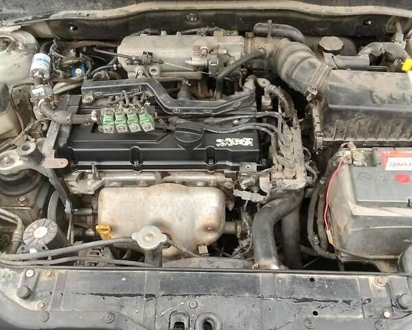 Серый Хендай Акцент, объемом двигателя 1.4 л и пробегом 235 тыс. км за 4250 $, фото 2 на Automoto.ua