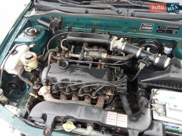 Зеленый Хендай Акцент, объемом двигателя 1.5 л и пробегом 235 тыс. км за 1350 $, фото 14 на Automoto.ua