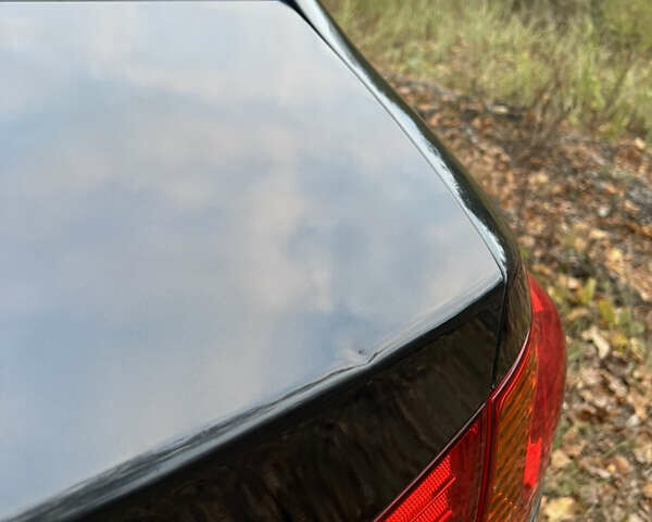 Черный Хендай Аванте, объемом двигателя 1.6 л и пробегом 154 тыс. км за 6000 $, фото 19 на Automoto.ua