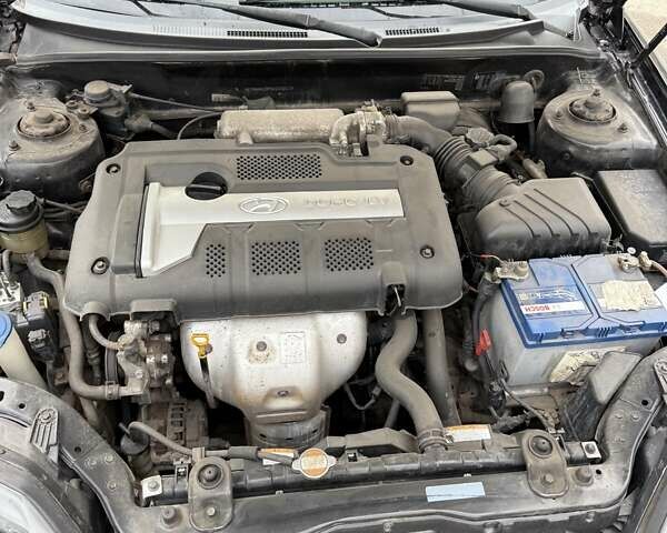 Чорний Хендай Купе, об'ємом двигуна 2 л та пробігом 112 тис. км за 5999 $, фото 9 на Automoto.ua