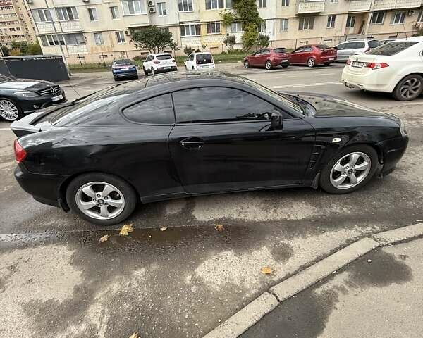 Чорний Хендай Купе, об'ємом двигуна 2 л та пробігом 112 тис. км за 5999 $, фото 8 на Automoto.ua