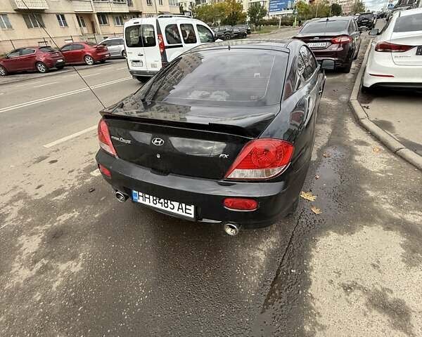 Чорний Хендай Купе, об'ємом двигуна 2 л та пробігом 112 тис. км за 5999 $, фото 7 на Automoto.ua