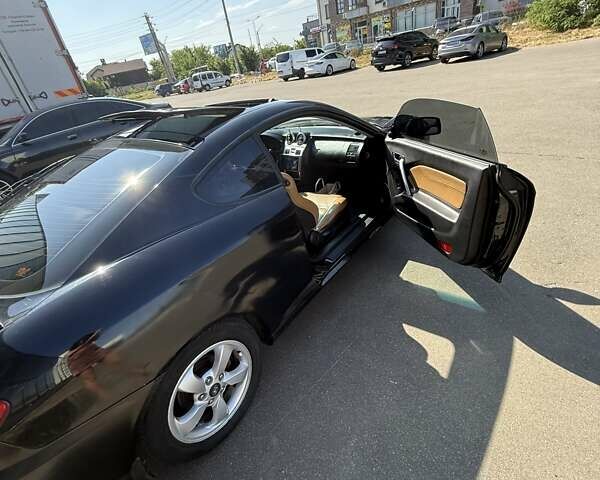 Чорний Хендай Купе, об'ємом двигуна 2 л та пробігом 112 тис. км за 5999 $, фото 3 на Automoto.ua