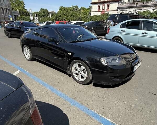 Чорний Хендай Купе, об'ємом двигуна 2 л та пробігом 112 тис. км за 5999 $, фото 2 на Automoto.ua