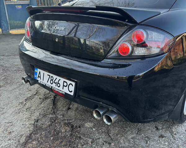 Черный Хендай Купе, объемом двигателя 1.98 л и пробегом 234 тыс. км за 5000 $, фото 6 на Automoto.ua