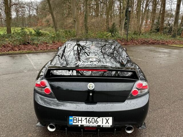 Чорний Хендай Купе, об'ємом двигуна 2 л та пробігом 198 тис. км за 8152 $, фото 5 на Automoto.ua