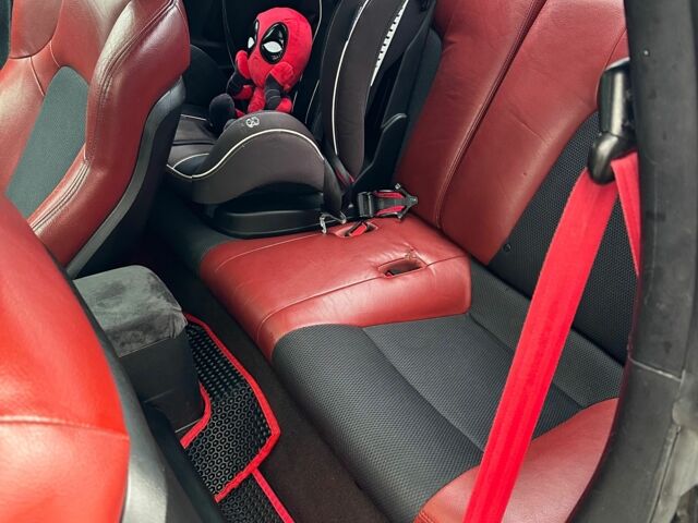 Чорний Хендай Купе, об'ємом двигуна 2 л та пробігом 198 тис. км за 8152 $, фото 9 на Automoto.ua